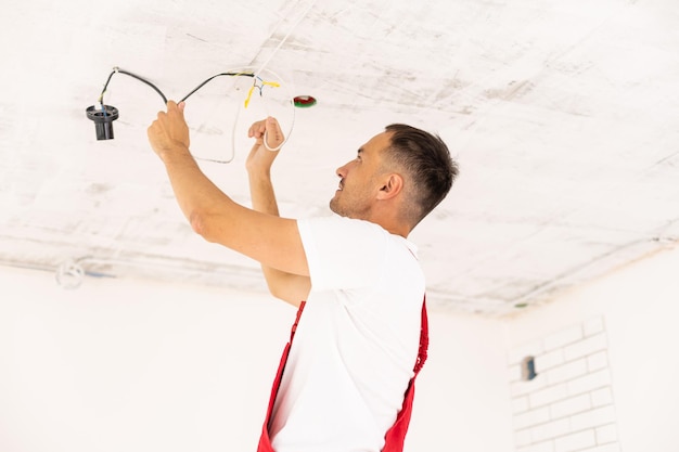 repair renovation electricity people concept close up builder electrician running wires indoors 493343 23560